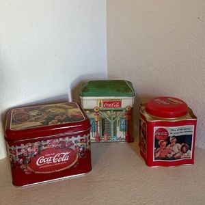 Three Coca Cola collectible tins